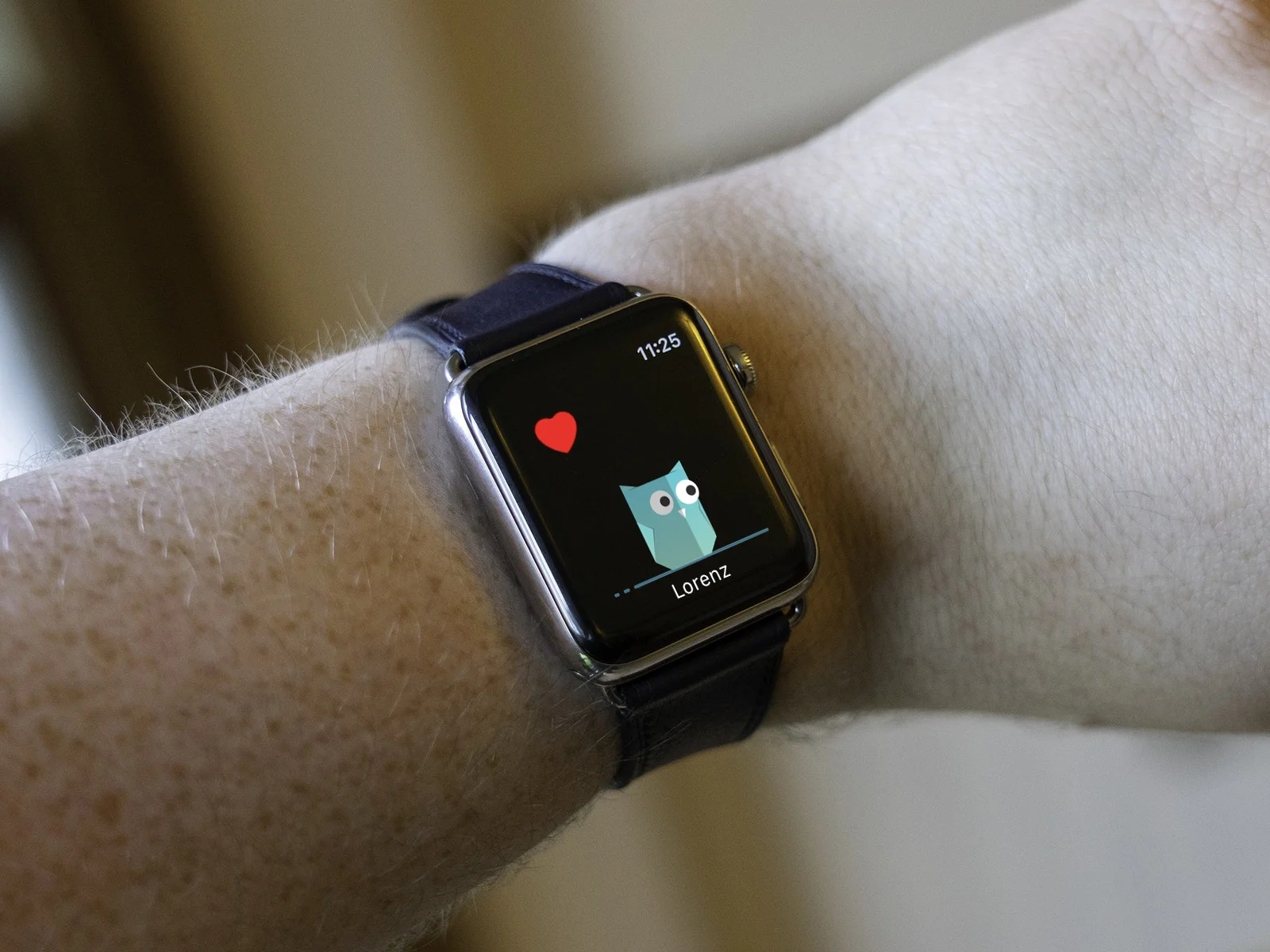 a hand wearing apple watch with connecting application active